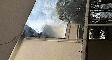 Alev alev yanan kayınpederinin evini kovayla su dökerek söndürmeye çalıştı